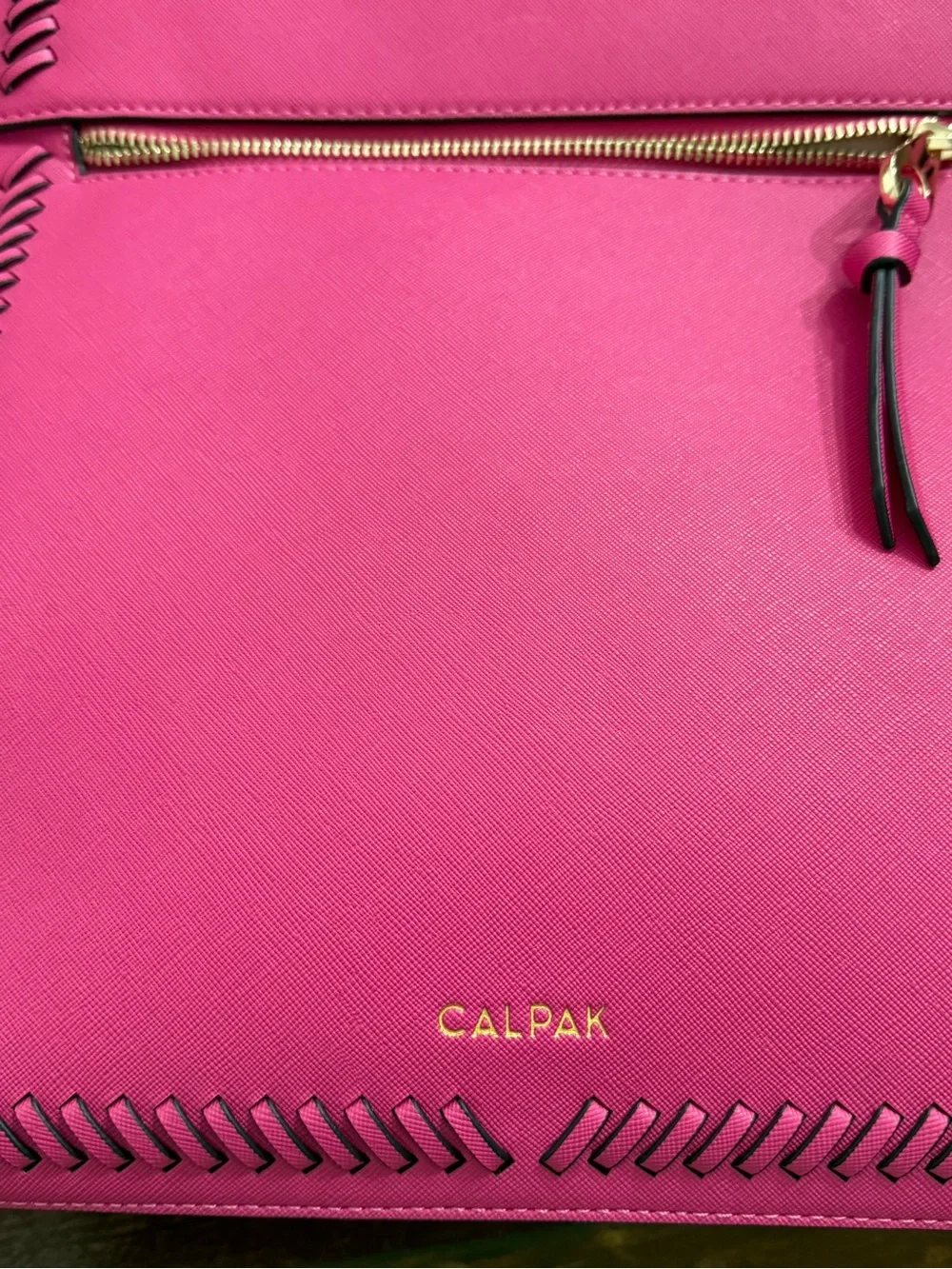 CALPAK Kaya Laptop Backpack in the vibrant Dragonfruit hot pink
